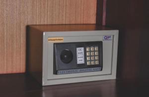 a small microwave oven sitting on top of a table at Khampiane Hotel in Vientiane