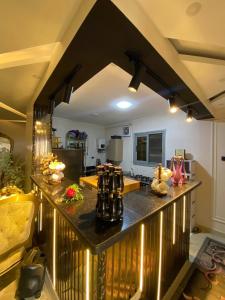 a kitchen with a black counter top in a room at Bianki Home in Alexandria