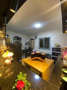 a kitchen with a table with drums on it at Bianki Home in Alexandria +5 photos