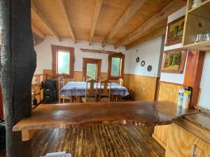 a dining room with a table and chairs at Colibrí lodge in Recinto