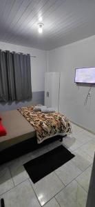 a bedroom with a bed in a room at Pousada Familiar 01 in Rio do Sul
