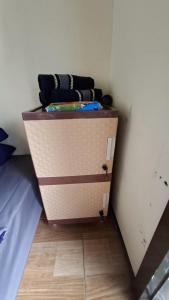 a small cabinet in a corner of a room at Hajeka Family 1 in Palayangan