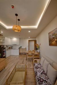 a living room with a couch and a table at Smile House - With In-unit Laundry & Kitchen in Sapa