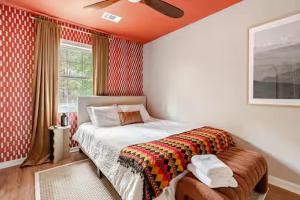 a bedroom with a bed and a window at Three Trees Retreat in Ellijay +54 photos