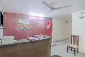 an office with a desk and a chair in a room at Collection O Green Park Residency 3 in New Delhi +21 photos