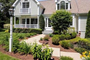 a house with a garden in front of it at Buzzards Bay Family Beach Firepit CapeCodCanal in Bourne