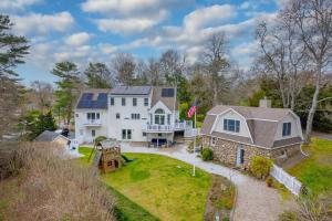 an aerial view of a large white house at Buzzards Bay Family Beach Firepit CapeCodCanal in Bourne