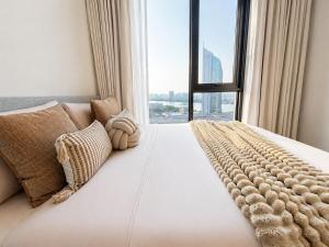 a bedroom with a large bed with a large window at Luxury Riverside Condo with riverside pool in Bangkok +61 photos