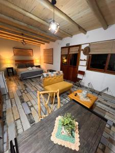a living room with a couch and a table at Ranchos de la Tata in Las Calles