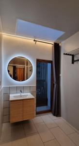 a bathroom with a sink and a mirror at Amara Resort Hua Hin in Hua Hin