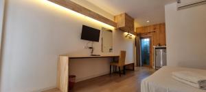 a room with a desk with a computer in it at Amara Resort Hua Hin in Hua Hin