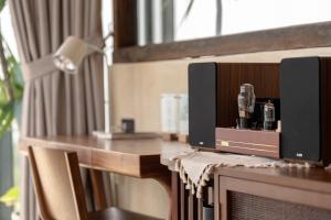 a desk with a coffee maker on top of it at Lemeraude BnB in Hengchun South Gate