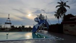 a slide in the middle of a swimming pool at Nara Paradise Beach in Narathiwat