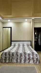 a bedroom with a large bed in a room at Центральна Садиба in Kryzhanivka +21 photos
