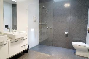 a bathroom with a shower and a toilet and a sink at Historic Getaway in Launceston +20 photos
