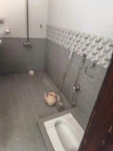 a bathroom with a sink and a shower stall at 430 Capital Suites in Islamabad