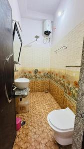a bathroom with a toilet and a sink at HOTEL SHREE JMM s14 near by in Udaipur +43 photos
