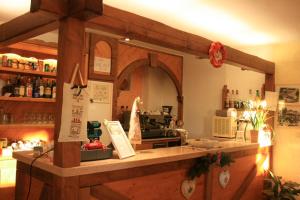 a kitchen with a counter in a room with a counter at Hotel Piccola Mantova in Bosco Chiesanuova