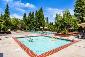 a swimming pool with two people playing in it at Spacious McCall Home Near Golf Course in McCall