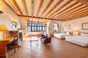 a bedroom with two beds and a fireplace at Wellness Forest Nasu in Nasu
