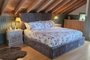a bedroom with a large bed in a room at Valhalla The Loft (Oceanfront Hot tub) in Salt Spring Island