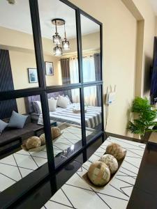 a living room with a large mirror and a couch at AnR Condo at Avida Towers in Cagayan de Oro