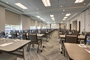 a large room with tables and chairs in it at Hyatt Place Milwaukee Downtown in Milwaukee
