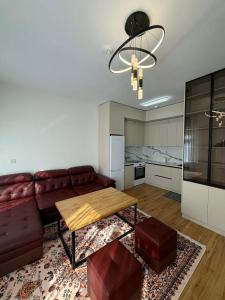 a living room with a couch and a table at Modern Luxury Debut - Untouched in Ulaanbaatar