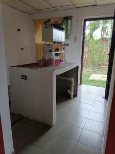 a kitchen with a counter with a microwave in it at Casa de Malle in Pocrí