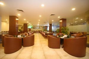 a restaurant with tables and chairs in a room at Gorkha Garden Hotel in Gorkhā +68 photos