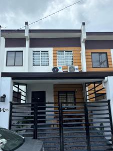 a house with a gate in front of it at Breena & Dhanie's Haven I in Labac