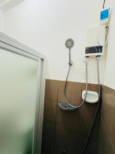 a shower in a bathroom with a shower at Breena & Dhanie's Haven I in Labac +35 photos