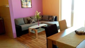 a living room with a couch and a table at SARITA Apartments in Makarska +67 photos