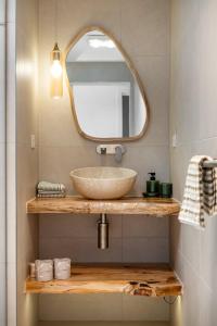 a bathroom with a sink and a mirror at Mellow mountains, boutique beach house in Portarlington +13 photos