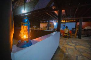 a blue lantern sitting on a wall in a restaurant at Tembo Tarangire Lodge & Camp in Madege