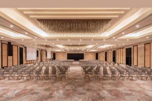 an empty ballroom with chairs and a stage at Hilton Cairo Heliopolis Hotel in Cairo +93 photos