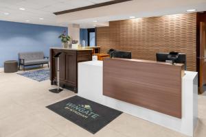 an office with a reception desk and a lobby at Wingate by Wyndham Cranberry in Cranberry Township +63 photos