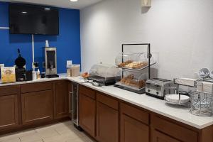 a kitchen with a counter with donuts on it at Baymont by Wyndham Findlay in Findlay
