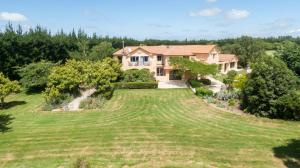 an aerial view of a house with a large yard at Tuscany Downs Estate in Darfield