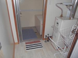 a laundry room with a washer and dryer at プチキャンプ場おちぼの郷 in Furano +43 photos