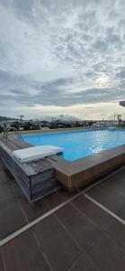 a large swimming pool on top of a building at Fare Iki in Papeete