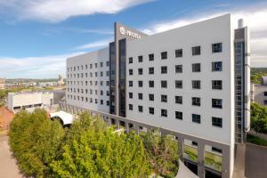 an office building with a sign on the side of it at Protea Hotel Fire & Ice! by Marriott Pretoria Menlyn in Pretoria
