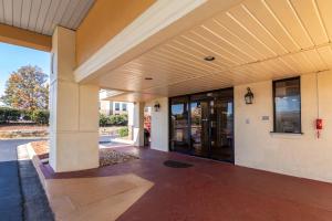 an outside view of a building with glass doors at Econo Lodge - Conyers in Conyers