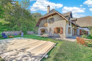 a house being constructed in a yard with a patio at Le Domaines Des Thermes - T2 in Gap