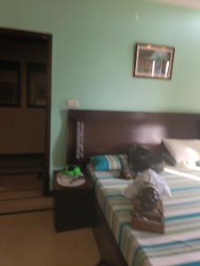 a hotel room with a bed with bags on it at The 430 District in Islamabad +19 photos