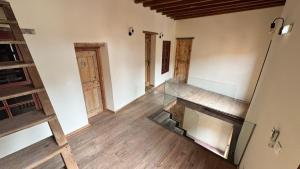 an empty room with a glass floor and a staircase at Avalon Boutique Hotel Rhodes in Rhodes Town