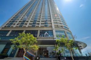 a tall building with a sign on it at Bow Luxury 3 in Danang