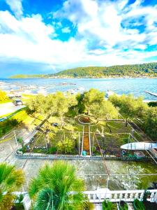 a park by the water with a roller coaster at Villa Csery 1stzime in Supetarska Draga +3 photos