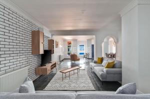 a living room with a couch and a table at TEKCE Villa Motto N21 in Kaş