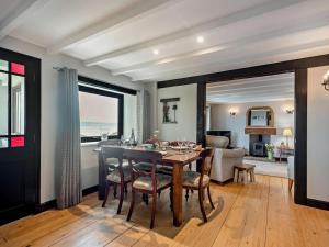 a dining room with a table and chairs at 3 Bed in Isle Of Arran oc-93240 in Pirnmill